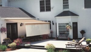 Cream colored patio shades at white suburban home
