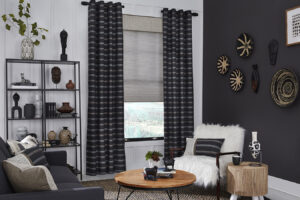 Navy blue and grey striped drapes hanging up in a living room