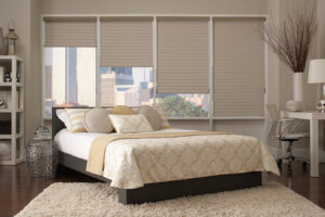 Cream colored bedroom with motorized shades