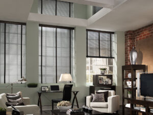 Motorized blinds in a living room with tall ceilings