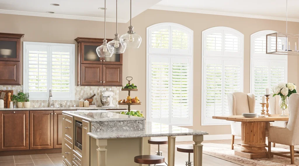 composite shutters in kitchen with arch top panels