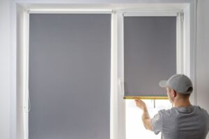 Grey blackout shades on the interior of a home
