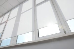 Large window with white rollers